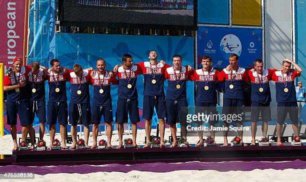 Gold medalists Russia stand on the podium during thee medal ceremony for the Men's Beach Soccer on day sixteen of the Baku 2015 European Games at...