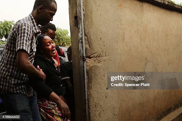 Relative of a man who was killed by police the previous evening grieves on June 28, 2015 in Bujumbura, Burundi. Patrick Ndikumana was shot and killed...