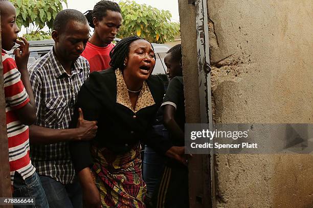 Relative of a man who was killed by police the previous evening grieves on June 28, 2015 in Bujumbura, Burundi. Patrick Ndikumana was shot and killed...