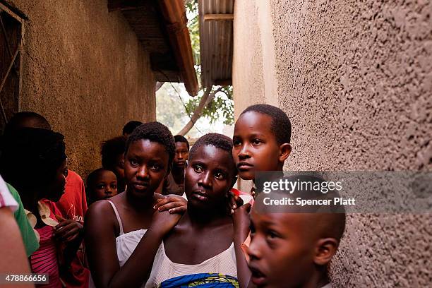 People gather in a street where a man who was killed by police the previous evening on June 28, 2015 in Bujumbura, Burundi. Patrick Ndikumana was...