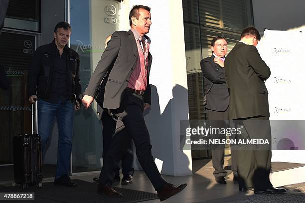 Brazil's national team coach Dunga leaves the hotel in Concepcion, Chile, on June 28 a day after crashing out of the Copa America in a quarter-final...