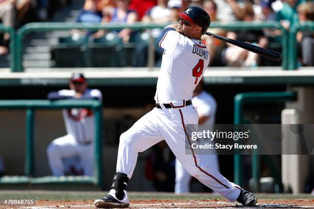 Ryan Doumit of the Atlanta Braves swings at a pitch in the second inning of a game against the Tampa Bay Rays at Champion Stadium on March 14, 2014...