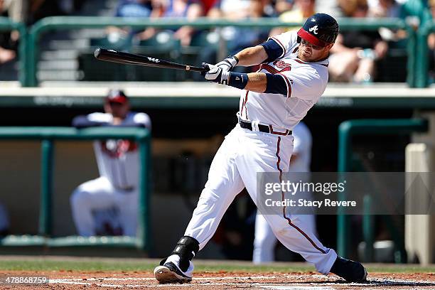 Ryan Doumit of the Atlanta Braves swings at a pitch in the second inning of a game against the Tampa Bay Rays at Champion Stadium on March 14, 2014...