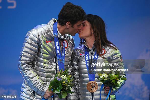 Bronze medalist Danelle Umstead and guide Robert Umstead kiss as they celebrate at the medal ceremony for women's Super Combined Visually Impaired on...