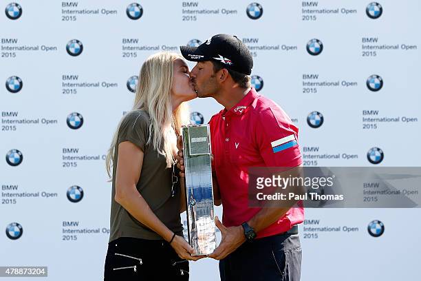 Pablo Larrazabal of Spain celebrates with the trophy and girlfriend Gala Ortin during the BMW International Open day four at the Eichenried Golf Club...