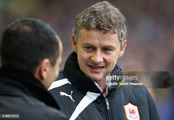 Cardiff City Manager Ole Gunnar Solskjaer is greeted by Everton Manager Roberto Martinez prior to the Barclays Premier League match between Everton...