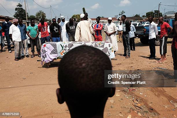 Muslim prayer service is held for a man killed in a confrontation the previous evening on June 28, 2015 in Bujumbura, Burundi. It is believed that...