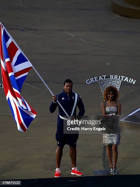 Flagbearer and Boxer, Joe Joyce of Great Britain carries his nations flag into the stadium during the Closing Ceremony for the Baku 2015 European...