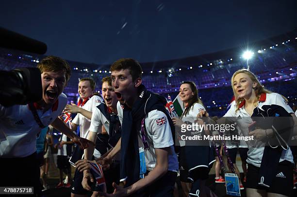 Swimmers Duncan Scott and Cameron Kurle of Great Britain celebrate as they enter the stadium during the Closing Ceremony for the Baku 2015 European...