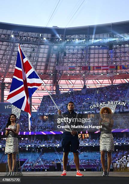 Flagbearer and Boxer, Joe Joyce of Great Britain carries his nations flag into the stadium during the Closing Ceremony for the Baku 2015 European...