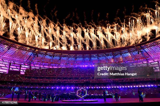 Fireworks explode above the stadium as dancers perform during the Closing Ceremony for the Baku 2015 European Games at Olympic Stadium on June 28,...