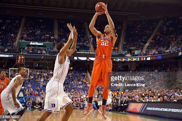 McDaniels of the Clemson Tigers puts up a shot against Rodney Hood of the Duke Blue Devils during the quarterfinals of the 2014 Men's ACC Tournament...