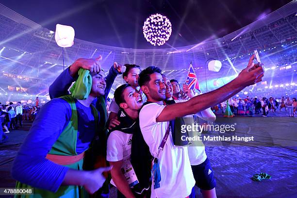 Athletes of Great Britain celebrate with performers during the Closing Ceremony for the Baku 2015 European Games at Olympic Stadium on June 28, 2015...