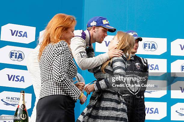 Sam Bird of Great Britain receives his winning trophy from Princess Beatrice of York and Sarah the Duchess of York at Battersea Park Track on June...