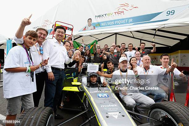 Formula E champion Nelson Piquet Jnr of Brazil celebrates his victory with his NEXTEV TCR team at Battersea Park Track on June 28, 2015 in London,...