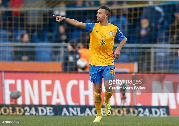 Karim Bellarabi of Braunschweig celebrates after scoring his team's first goal during the Bundesliga match between Eintracht Braunschweig and VfL...