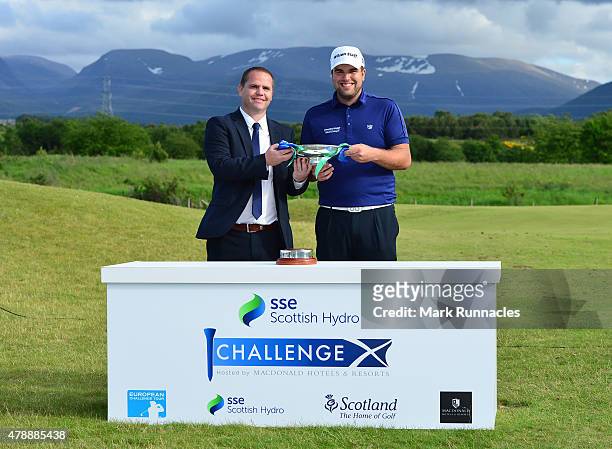 Jack Senior , of England winner of the 2015 SSE Scottish Hydro Challenge is presented with the trophy by Colin Pirie. Regional Manager, SSE Scottish...