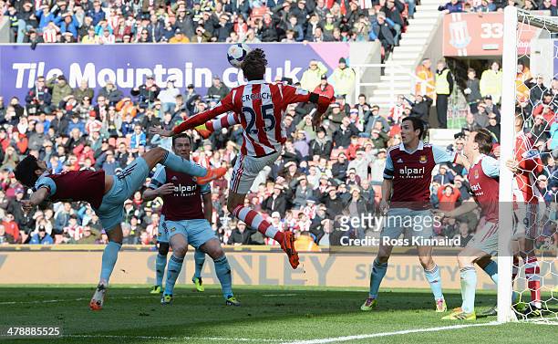 Peter Crouch of Stoke City jumps for the ball which leads to a goal for Peter Odemwingie of Stoke City during the Barclays Premier League match...