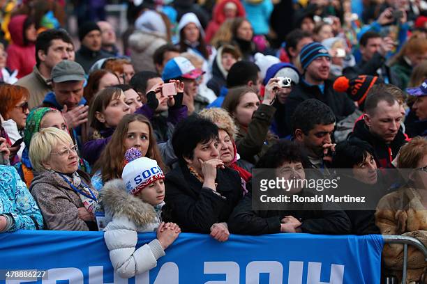 The crowd watch on at the medal ceremony for the the Women's 12.5km Visually Impaired Biathlon on day eight of the Sochi 2014 Paralympic Winter Games...