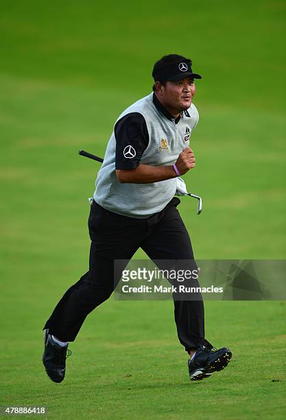 Prom Meesawat of Thailand races after his approach to the 4th play off hole during the fourth round of the 2015 SSE Scottish Hydro Challenge at the...