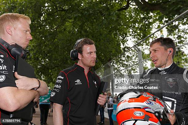 Loic Duval of France talks with team members on the grid at Battersea Park Track on June 28, 2015 in London, England.