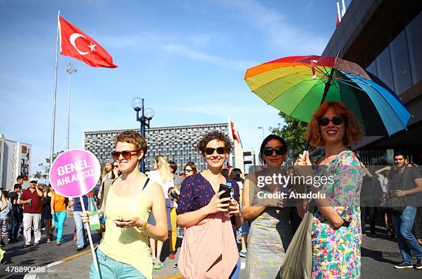 People are seen during a LGBT parade on June 28, 2015 in Taksim region of Istanbul, Turkey.