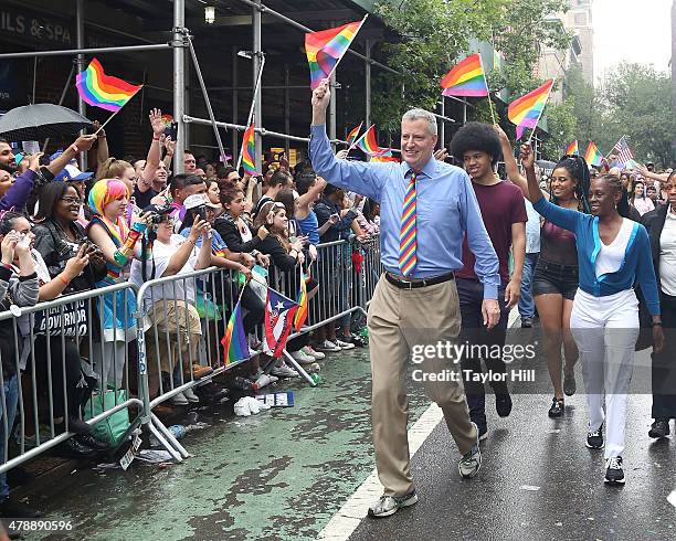 New York City Mayor Bill de Blasio, his wife, Chirlane McCray, and his children, Dante de Blasio and Chiara de Blasio march in the 2015 NYC Pride...