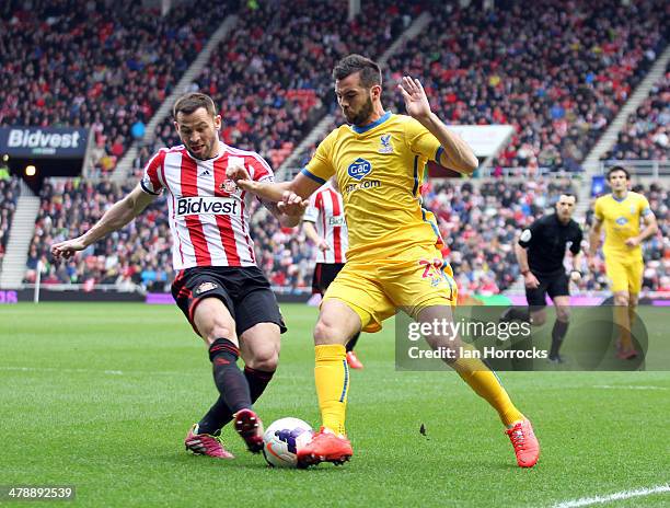 Phil Bardsley of Sunderland challenges Jo Ledley of Crystal Palace during the Barclays Premier League match between Sunderland and Crystal Palace at...