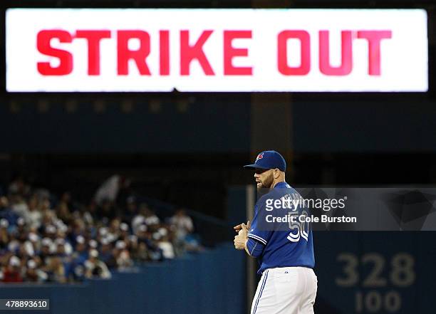 Toronto, Canada - June 28 - Toronto Blue Jays relief pitcher Steve Delabar prepares for his next pitch after a strike out during MLB action against...