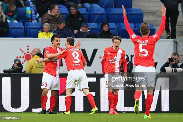 Shinji Okazaki of Mainz celebrates his team's fourth goal with team mates Zdenek Pospech, Nicolai Mueller and Benedikt Saller during the Bundesliga...