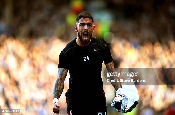 Ashkan Dejagah of Fulham celebrates after scoring the opening goal during the Barclays Premier league match between Fulham and Newcastle United at...
