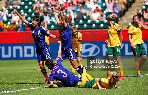 Saki Kumagai, Rumi Utsugi and Azusa Iwashimizu of Japan celebrate a goal by Mana Iwabuchi against Australia during the FIFA Women's World Cup Canada...