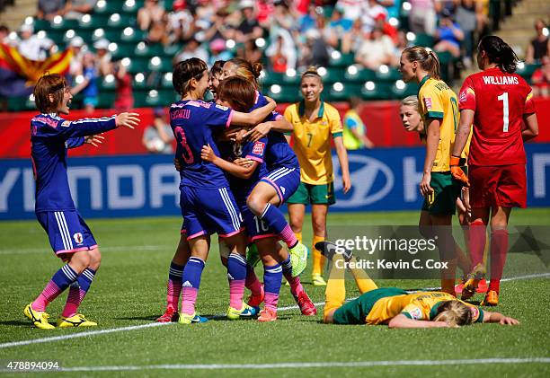 Mana Iwabuchi of Japan celebrates scoring a goal against Australia during the FIFA Women's World Cup Canada 2015 Quarter Final match between...