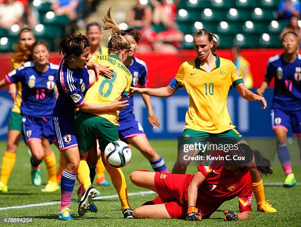 Elise Kellond-Knight defends as goalkeeper Lydia Williams of Australia attempts to save the ball against Azusa Iwashimizu of Japan during the FIFA...