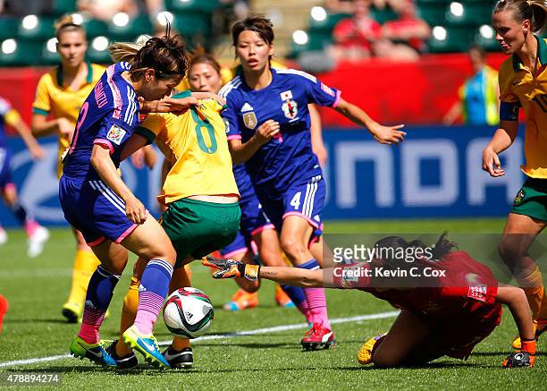 Elise Kellond-Knight defends as goalkeeper Lydia Williams of Australia attempts to save the ball against Azusa Iwashimizu of Japan during the FIFA...