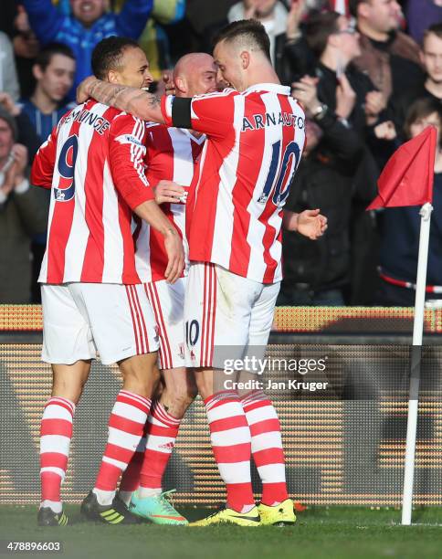 Peter Odemwingie of Stoke City celebrates with Stephen Ireland and Marko Arnautovic as he scores their third goal during the Barclays Premier League...