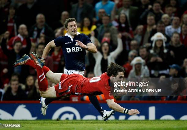 Wales's Rhodri Williams dives over to score a try during the Six Nations international rugby union match between Wales and Scotland at the Millennium...