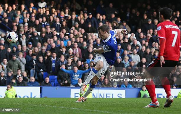 Seamus Coleman of Everton scores the winning goal during the Barclays Premier League match between Everton and Cardiff City at Goodison Park on March...