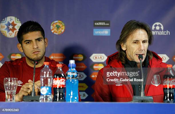 Carlos Zambrano of Peru and Ricardo Gareca, coach of Peru, talk during a press conference prior to the semi final match against Chile at Nacional...