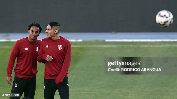 Peru's players Paolo Guerrero and Andre Carrillo take part in a training session at the National Stadium in Santiago on June 28 during the Copa...