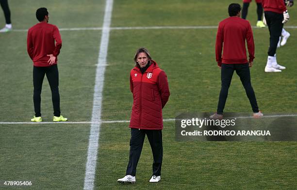 Peru's coach Ricardo Gareca looks on during a training session at the National Stadium in Santiago on June 28 in the framework of the Copa America...