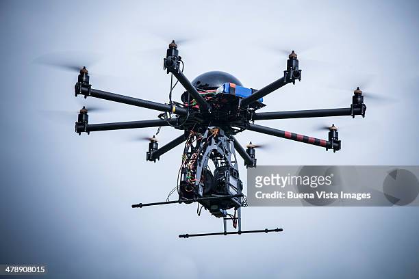 drone with camera - octocopter stock pictures, royalty-free photos & images