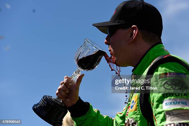 Kyle Busch, driver of the M&M's Crispy Toyota, celebrates after winning the NASCAR Sprint Cup Series Toyota/Save Mart 350 at Sonoma Raceway on June...