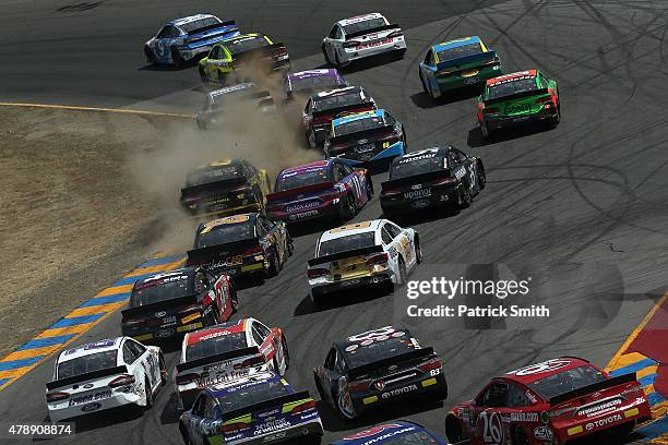 Sam Hornish Jr., driver of the Jacob Companies Ford, leads a pack of cars during the NASCAR Sprint Cup Series Toyota/Save Mart 350 at Sonoma Raceway...