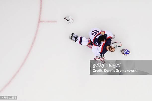 Steve Cash of the United States celebrates winning the gold medal with Nikko Landeros after the Ice Sledge Hockey Gold Medal game between the United...