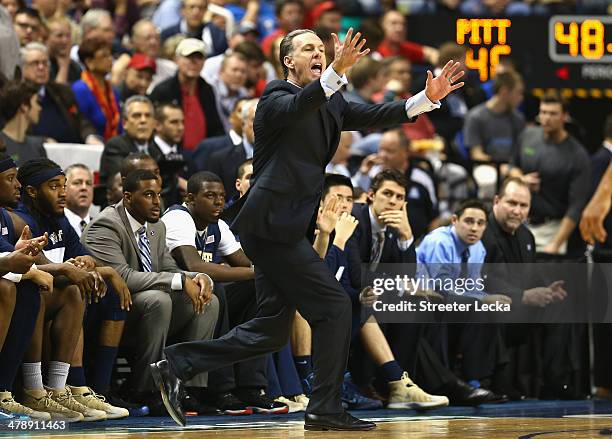 Head coach Jamie Dixon of the Pittsburgh Panthers reacts against the Virginia Cavaliers during the semifinals of the 2014 Men's ACC Basketball...