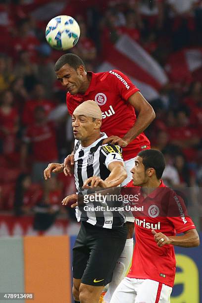 Ernando of Internacional battles for the ball against Ricardo Oliveira of Santos during the match between Internacional and Santos as part of...