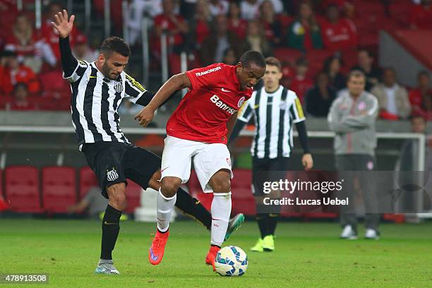 Anderson of Internacional battles for the ball against Thiago Mendes of Santos during the match between Internacional and Santos as part of...