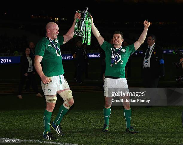 Captain, Paul O'Connell of Ireland and Brian O'Driscoll celebrate with the Six Nations Championship during the RBS Six Nations match between France...