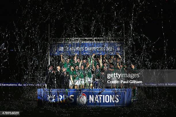 Brian O'Driscoll and captain Paul O'Connell of Ireland celebrate with their team-mates as they lift the trophy after winning the six nations...